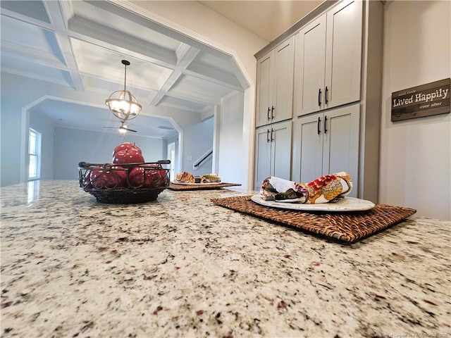 mudroom featuring beam ceiling, ornamental molding, and coffered ceiling