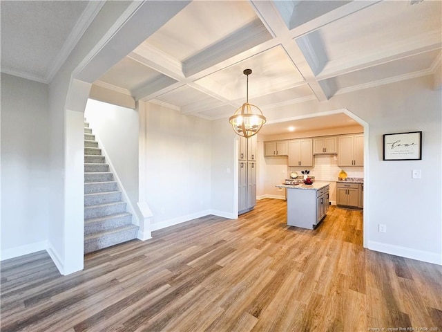 kitchen featuring a center island, light hardwood / wood-style floors, gray cabinets, coffered ceiling, and pendant lighting