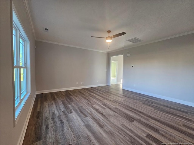 unfurnished room featuring dark hardwood / wood-style flooring, ornamental molding, and ceiling fan