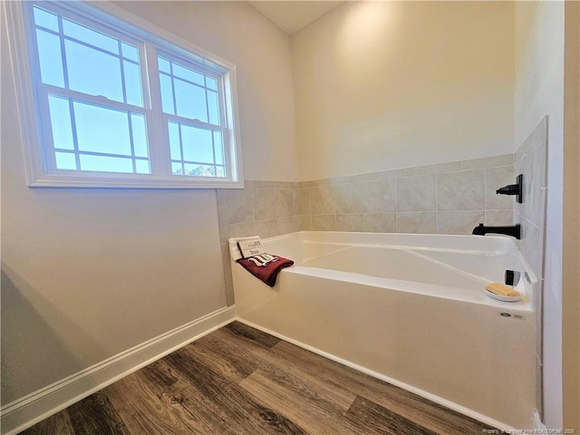 bathroom featuring a tub and wood-type flooring