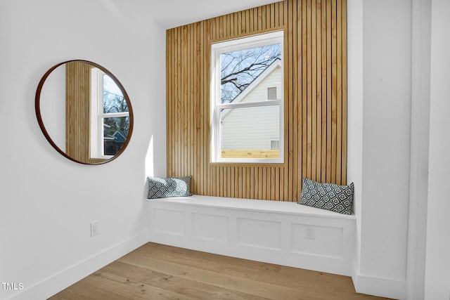 unfurnished room featuring baseboards and wood finished floors