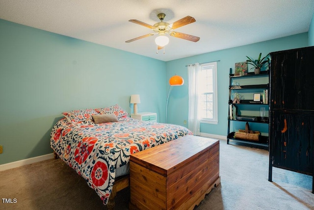 carpeted bedroom with baseboards and a ceiling fan