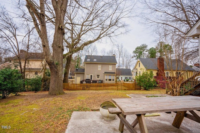 view of yard featuring a patio area, fence, and a deck