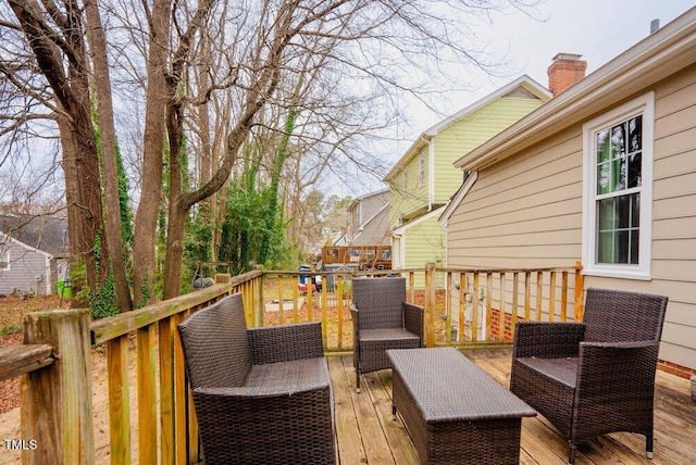 wooden deck featuring an outdoor living space