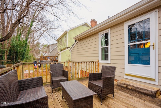 wooden deck featuring outdoor lounge area