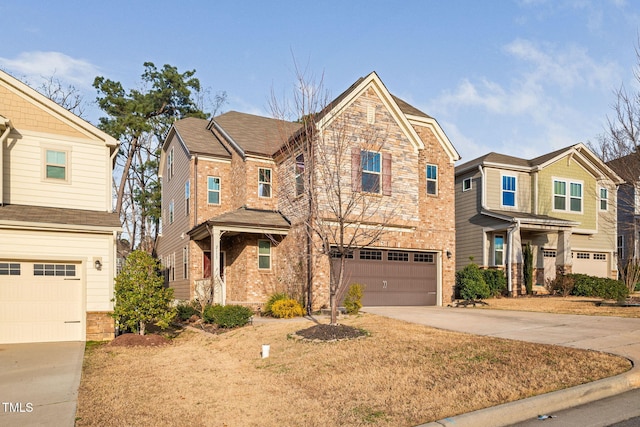 view of front of house featuring a garage, stone siding, brick siding, and driveway