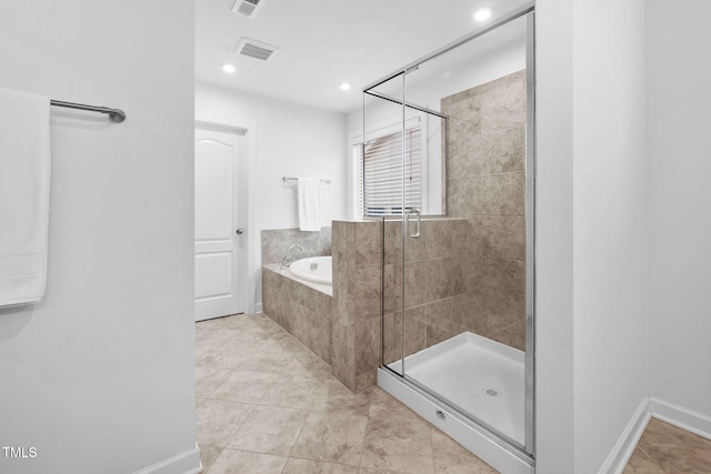 full bathroom with a stall shower, a garden tub, visible vents, and recessed lighting