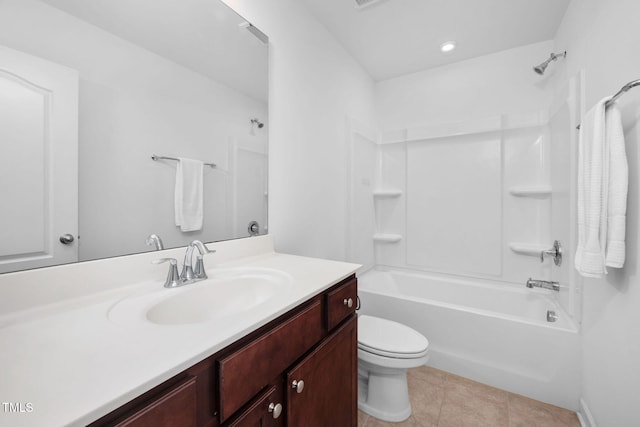 full bath featuring toilet, shower / bathing tub combination, vanity, and tile patterned floors