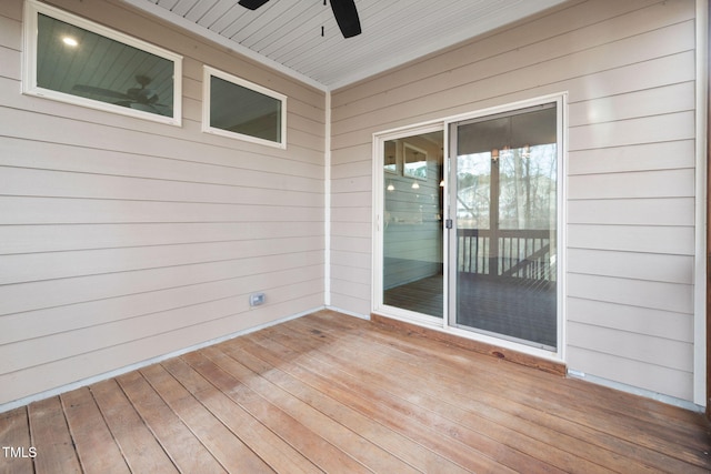 wooden terrace with a ceiling fan