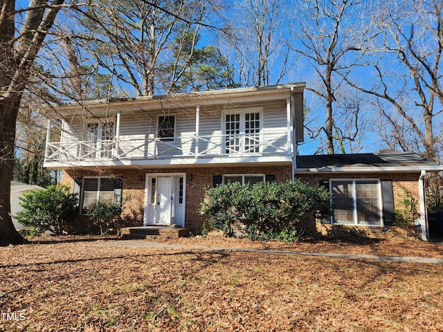 view of front of home with a balcony