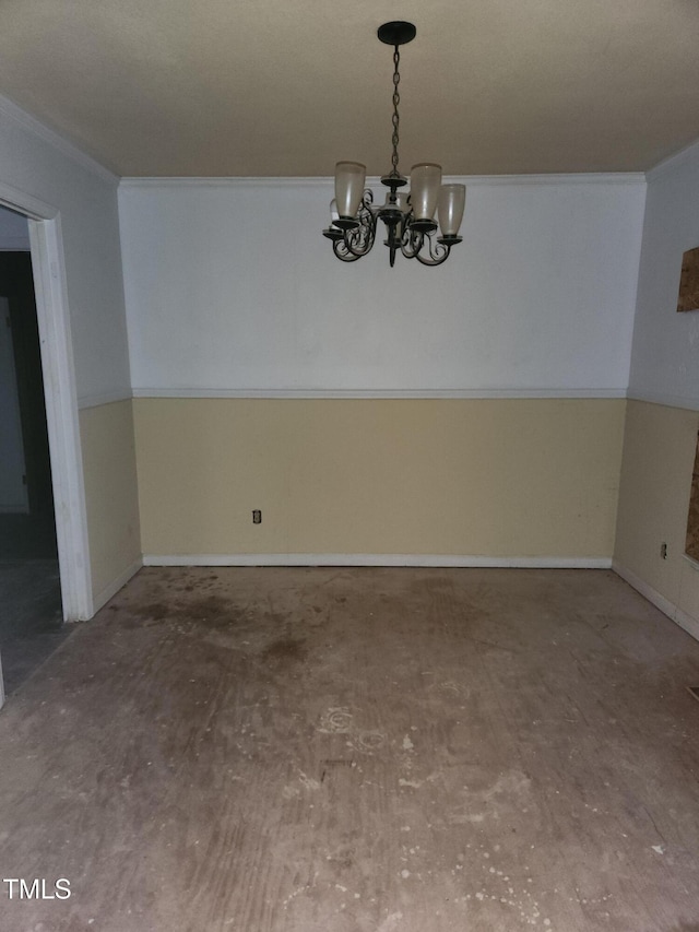 unfurnished dining area featuring crown molding and a notable chandelier