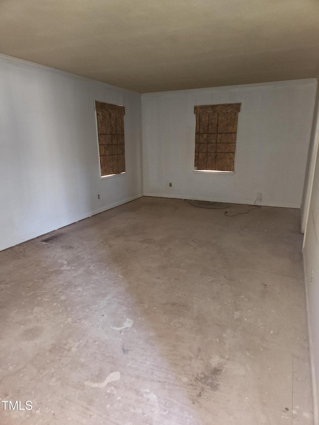 unfurnished room with unfinished concrete floors