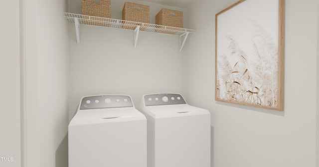 clothes washing area with separate washer and dryer