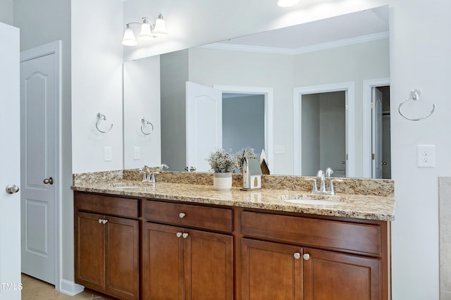 bathroom with ornamental molding and vanity