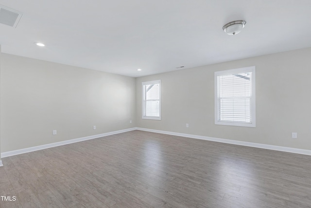 spare room featuring hardwood / wood-style flooring