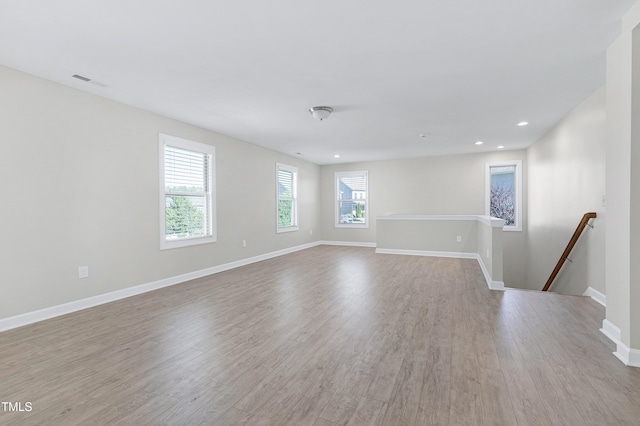 spare room featuring light hardwood / wood-style flooring