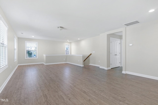 unfurnished room with hardwood / wood-style flooring