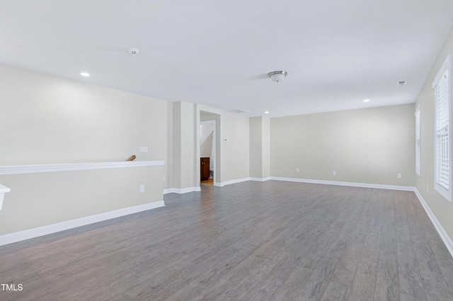 unfurnished room with hardwood / wood-style floors