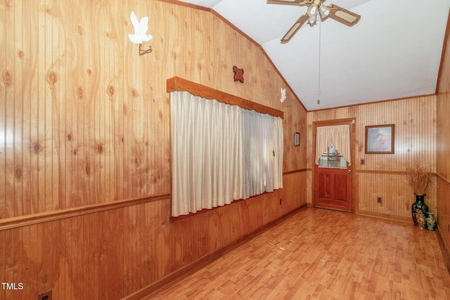 811 Queens St NW, Lenoir, NC 28645 - spare room featuring vaulted ceiling, wood finished floors, wooden walls, and a ceiling fan