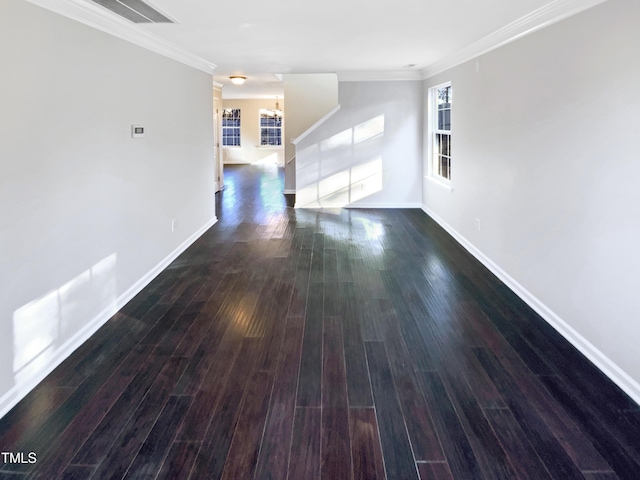 interior space with baseboards, dark wood-style flooring, an inviting chandelier, and crown molding