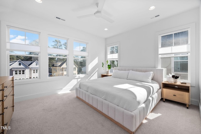 bedroom with light carpet, baseboards, visible vents, and recessed lighting