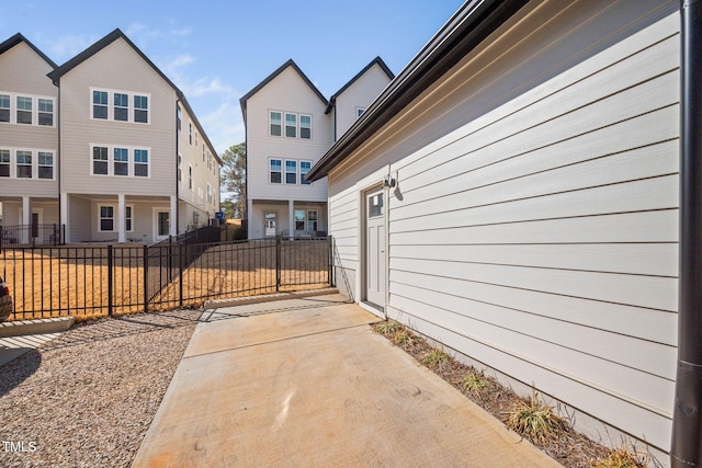 view of side of home with fence