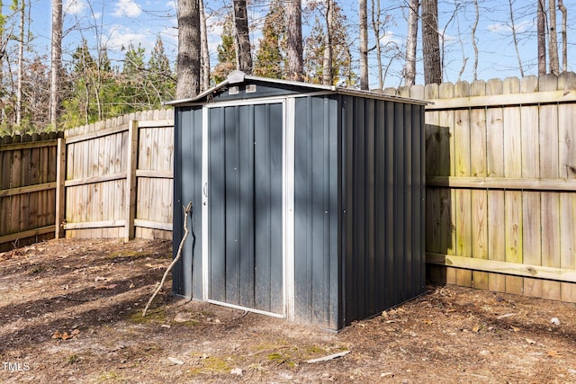 view of shed featuring a fenced backyard