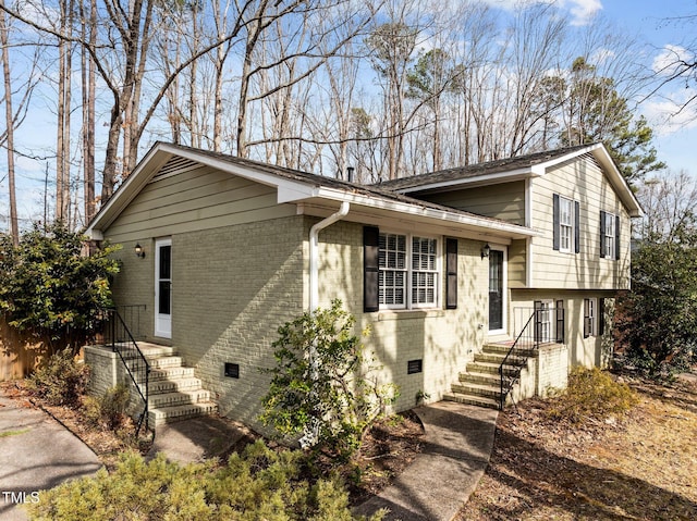 tri-level home with crawl space and brick siding