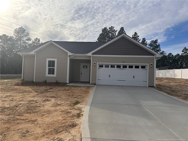 ranch-style house featuring a garage