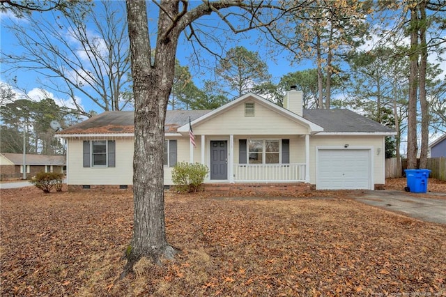 ranch-style home featuring a garage and a porch