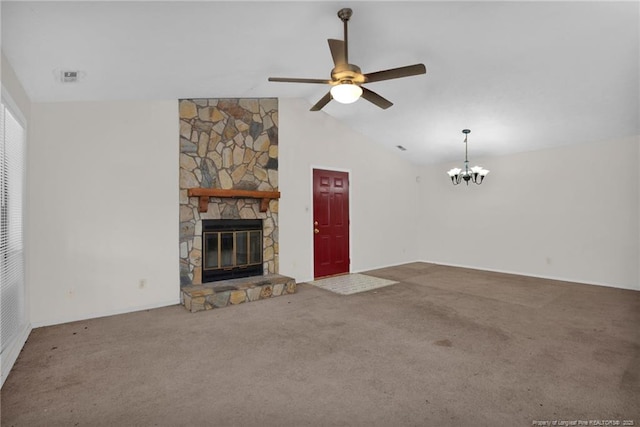 unfurnished living room featuring ceiling fan with notable chandelier, carpet, vaulted ceiling, and a stone fireplace