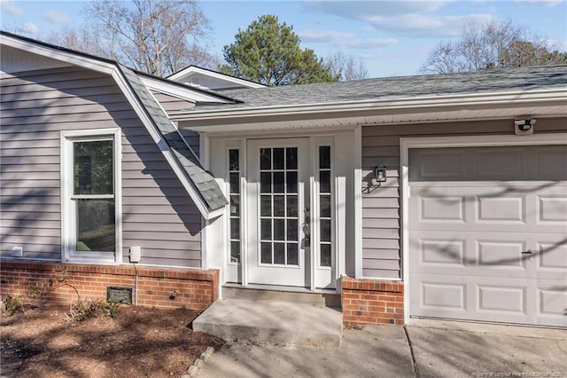 entrance to property featuring a garage