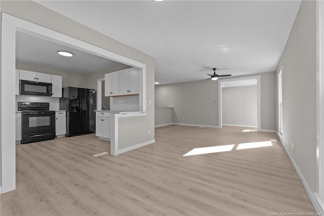 interior space with ceiling fan and light hardwood / wood-style floors