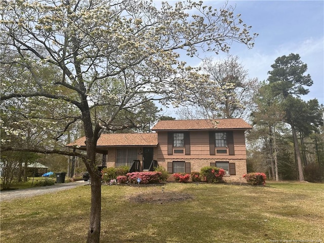 split level home with a front yard