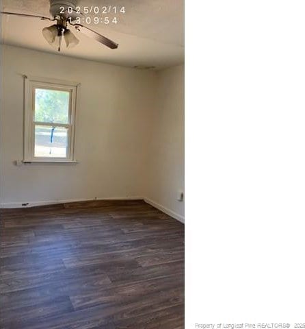 empty room with ceiling fan and dark hardwood / wood-style floors