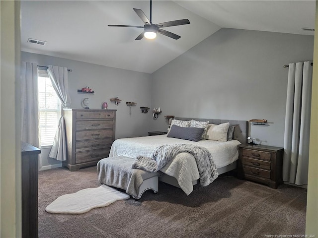 bedroom with ceiling fan, vaulted ceiling, and carpet