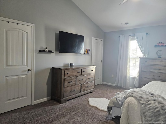 carpeted bedroom with lofted ceiling