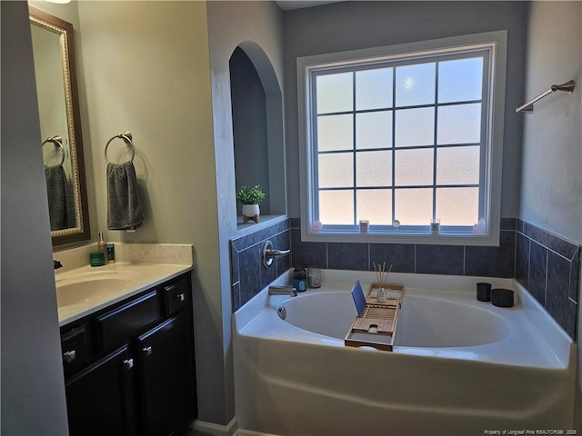 bathroom featuring vanity and a bathtub