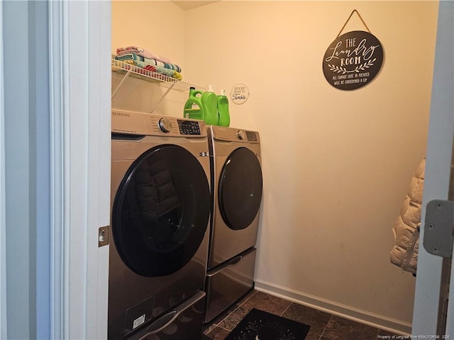 clothes washing area with separate washer and dryer