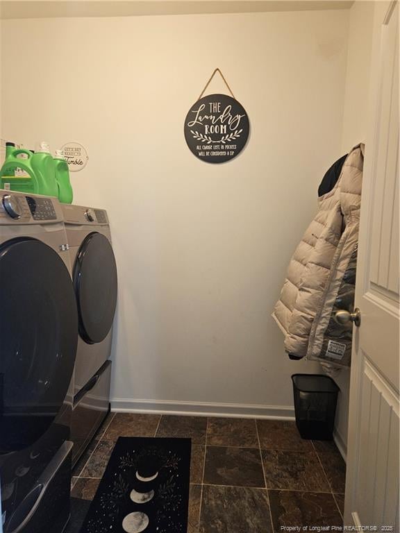 clothes washing area with washing machine and clothes dryer