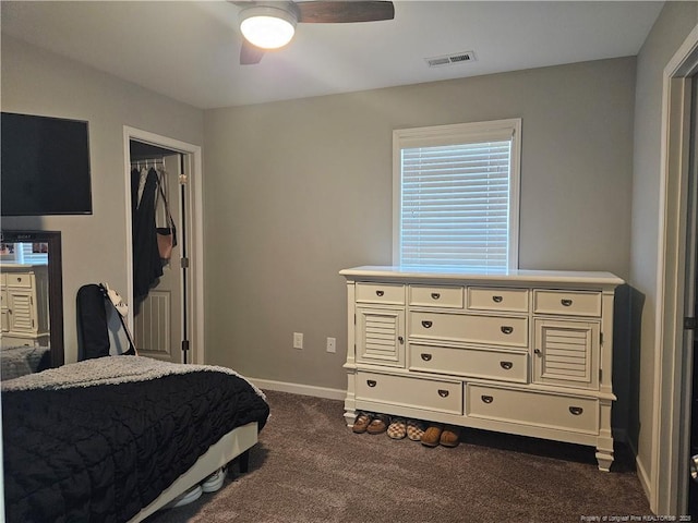 bedroom featuring ceiling fan and dark colored carpet