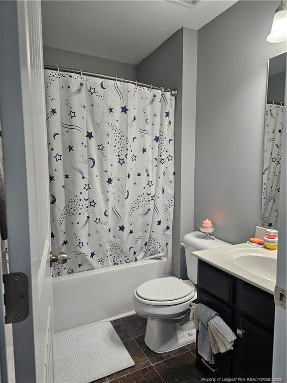 full bathroom with toilet, shower / bath combo with shower curtain, and vanity