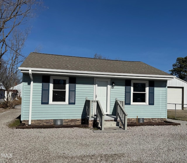212 Craig Ave, Henderson, NC 27537 - view of front of house with crawl space, a shingled roof, and entry steps
