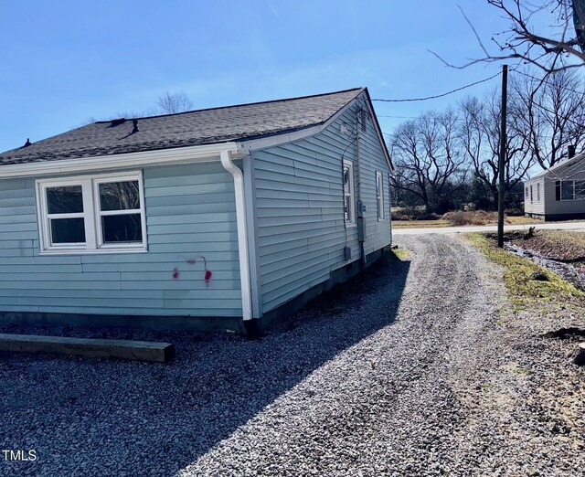 212 Craig Ave, Henderson, NC 27537 - view of home's exterior featuring driveway and roof with shingles