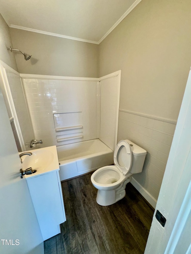 212 Craig Ave, Henderson, NC 27537 - full bath with a wainscoted wall, tile walls, toilet, vanity, and wood finished floors