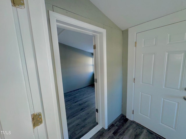 212 Craig Ave, Henderson, NC 27537 - hallway featuring dark wood-type flooring and vaulted ceiling