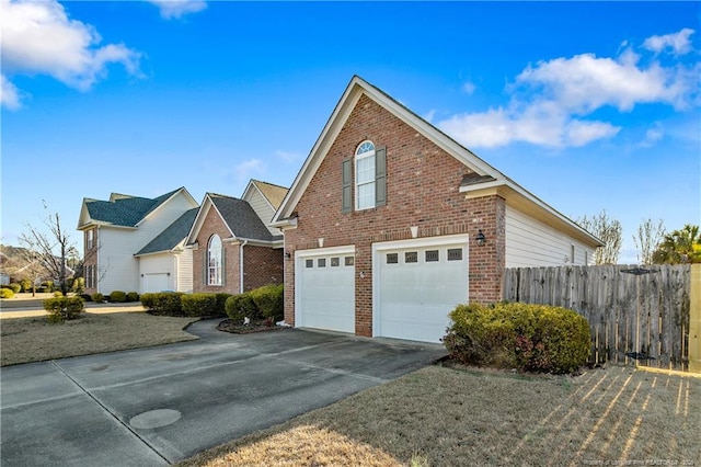 view of front of property with a front yard and a garage