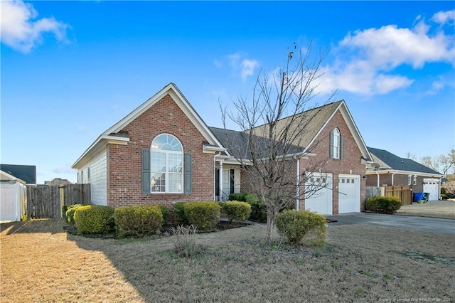 view of front property with a garage and a front yard