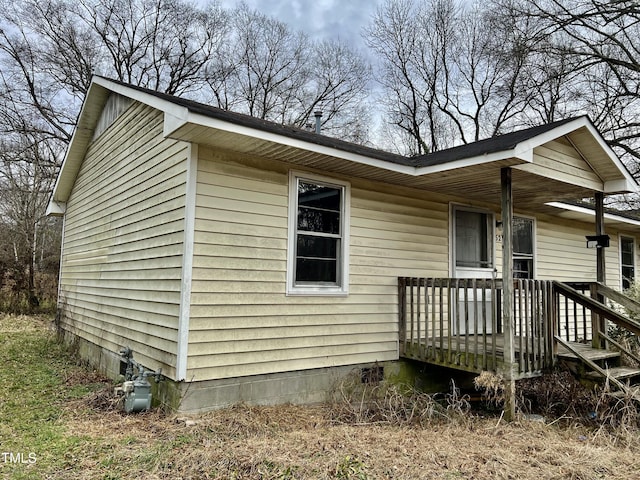 view of side of home with a porch