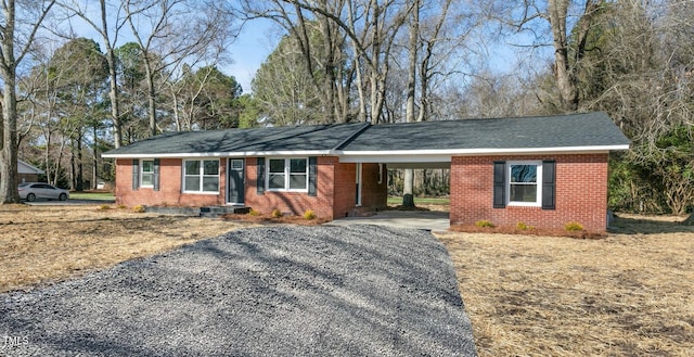 single story home featuring a carport